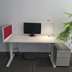 Knoll Electric Height Adjustable Desk - White w/Red privacy screen/tack board and a pedestal cabinet - 58"W x 29"D - Height adjustable between 25" and 48.5" - $575.00/set.