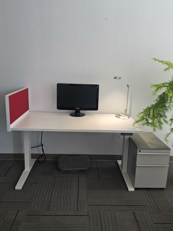 Knoll Electric Height Adjustable Desk - White w/Red privacy screen/tack board and a pedestal cabinet - 58"W x 29"D - Height adjustable between 25" and 48.5" - $575.00/set.